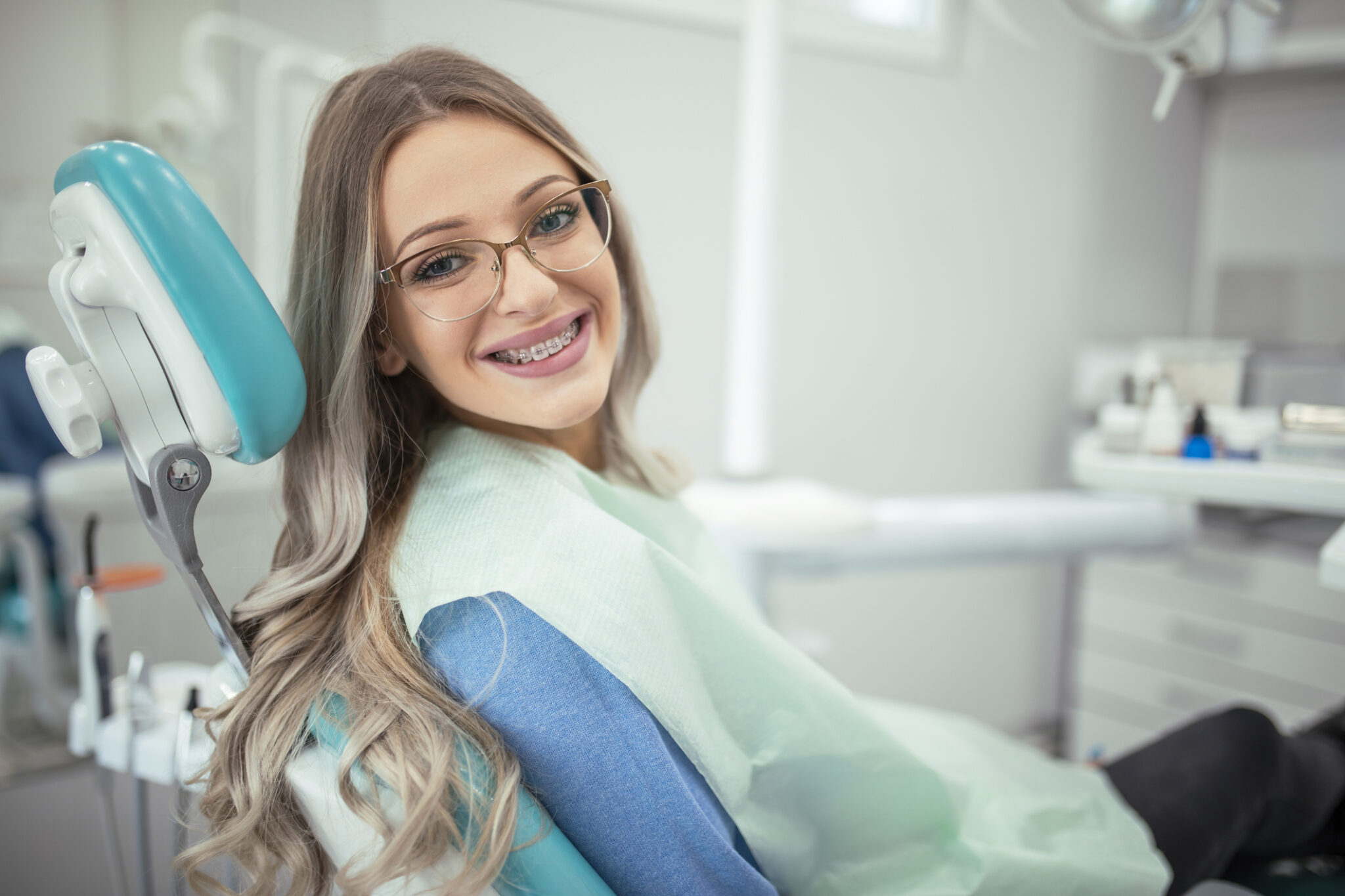 Woman with braces came to see the dentist for exam