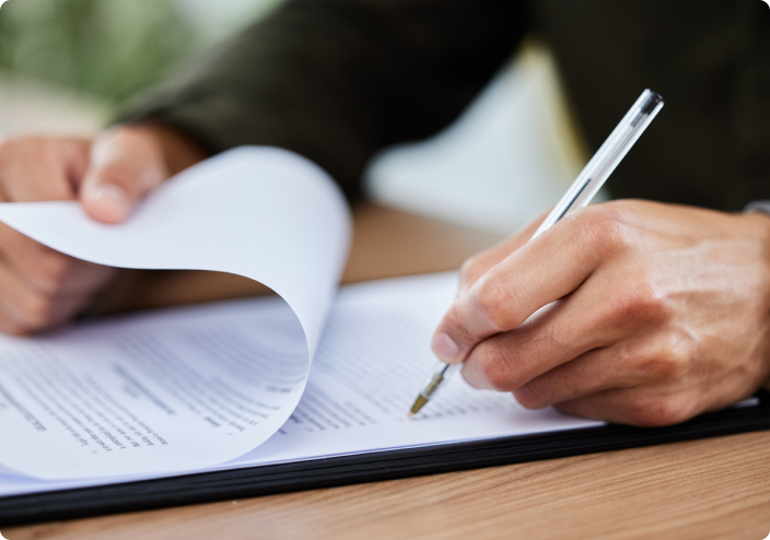 close up of man filling out patient forms